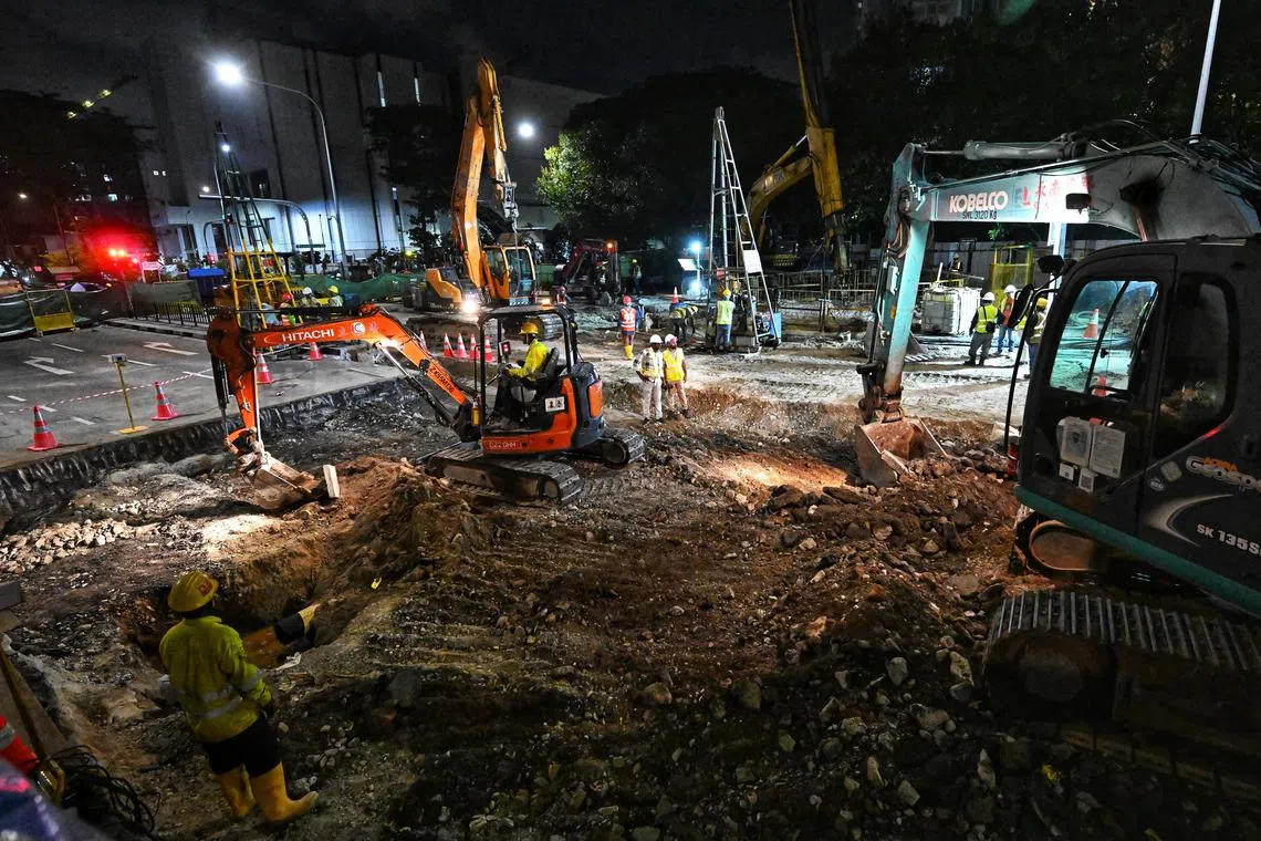 Repair works on the sinkhole under way at about 9.45pm on July 28.