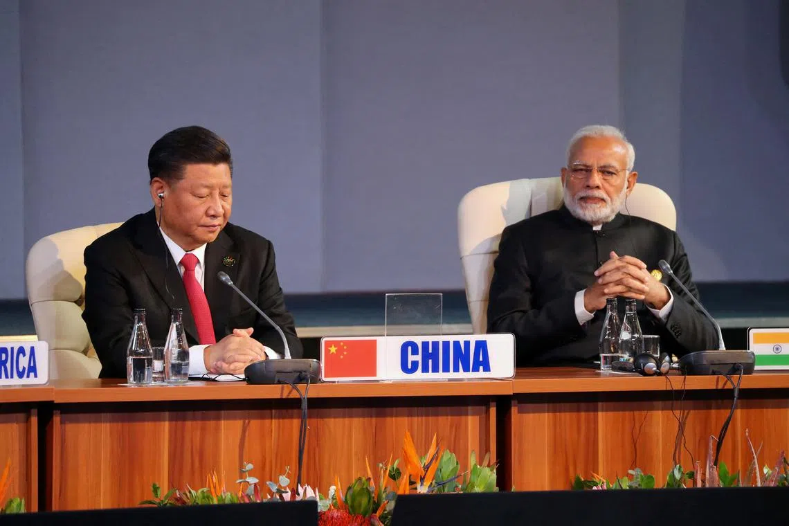 FILE PHOTO: Indian Prime Minister Narendra Modi and China's President Xi Jinping attend the BRICS summit meeting in Johannesburg, South Africa, July 27, 2018. REUTERS/Mike Hutchings/File Photo