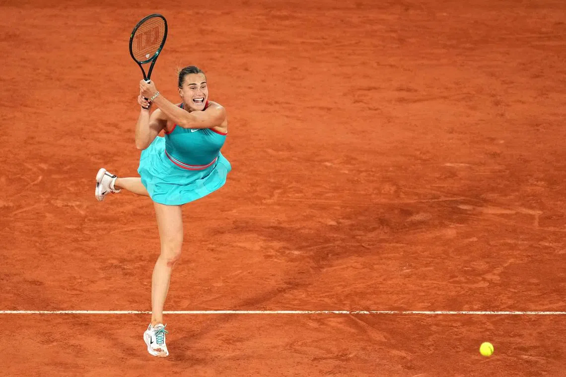 Aryna Sabalenka serves to Iga Swiatek during their French Open semi-final clash.