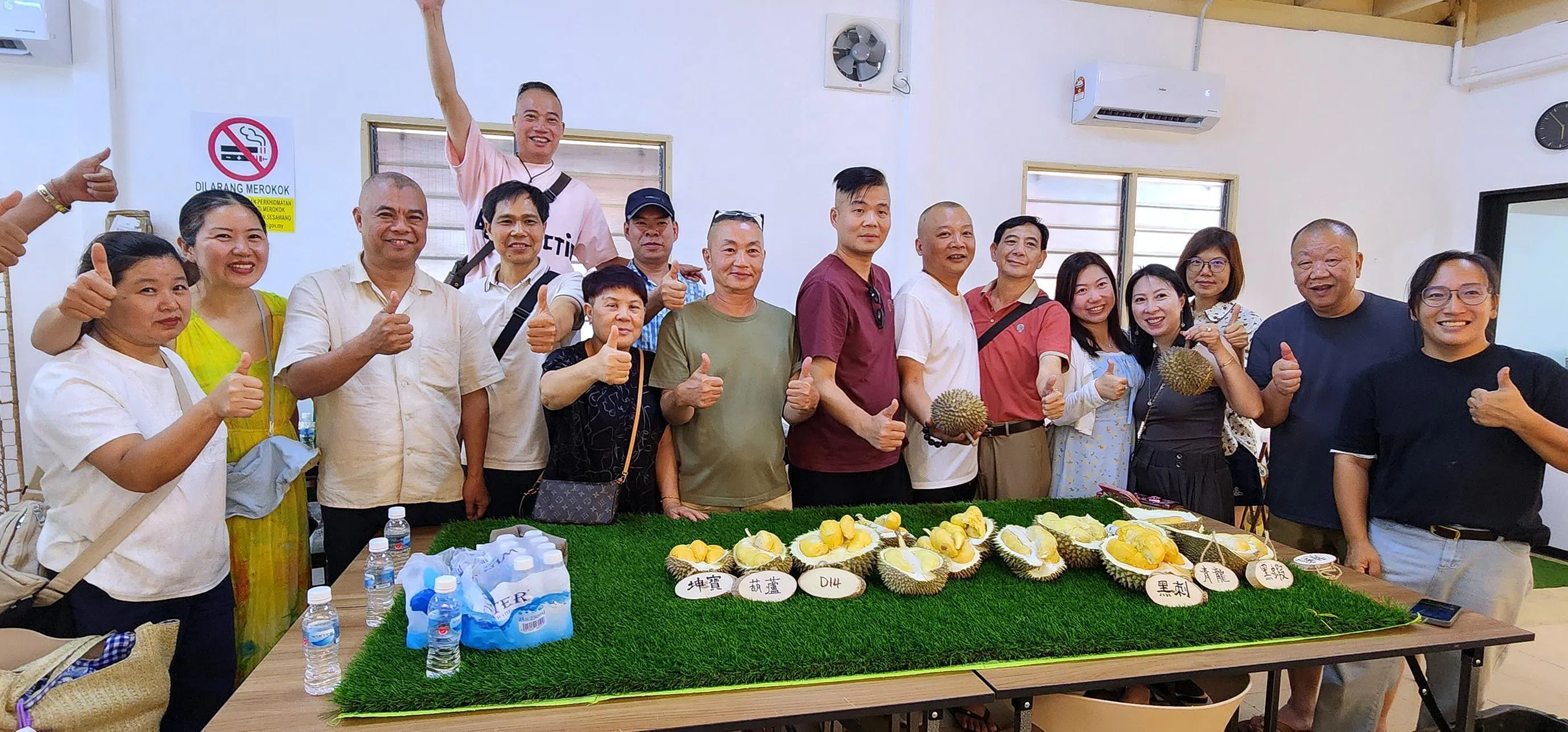 Tourists from China enjoy a durian omakase experience in Penang, sampling the king of fruits in a curated tasting session on July 1, with Steven Yam of Durian Tasting Home (right).