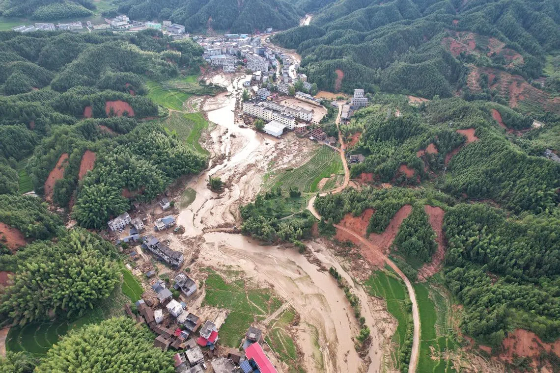 The aftermath of a landslide in Zhoumensi town after heavy rainfall brought by remnants of Typhoon Gaemi in Zixing, Hunan province, China.  
