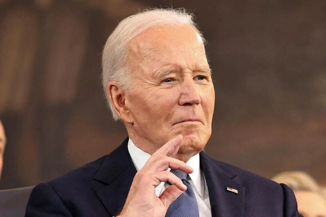 FILE PHOTO: Former U.S. President Joe Biden listens as U.S. President Donald Trump speaks during inauguration ceremonies in the Rotunda of the U.S. Capitol on January 20, 2025 in Washington, DC. Chip Somodevilla/Pool via REUTERS/File Photo