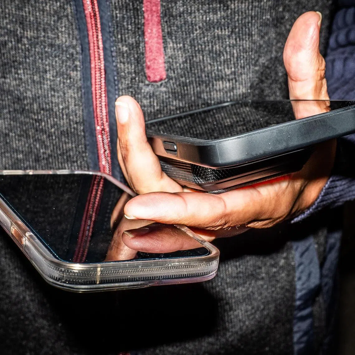 Choudhary Muhammad Kamran, an entrepreneur with businesses in Dubai, New York, Singapore and Pakistan, with two phones and a battery bank in New York.