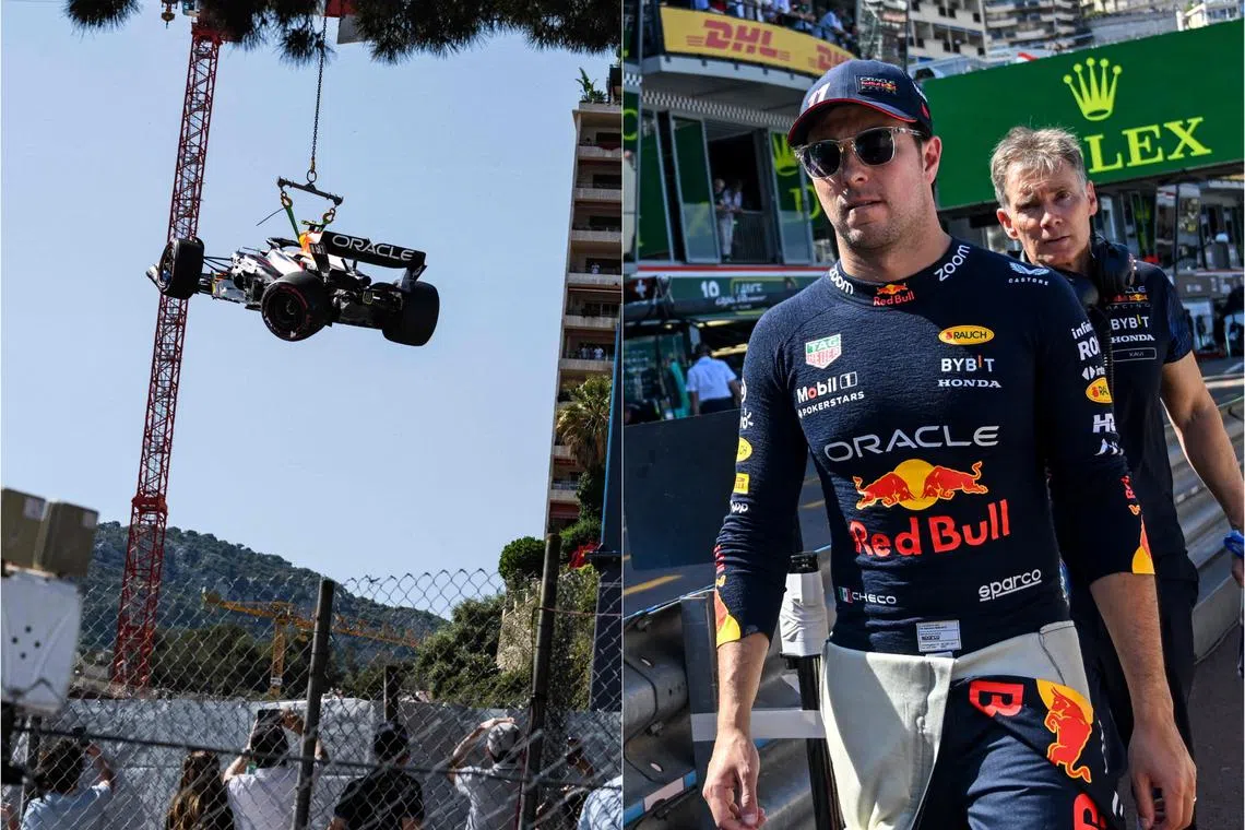 Sergio Perez's Red Bull car is removed from the track after he crashed during qualifying, ahead of the Monaco grand prix.