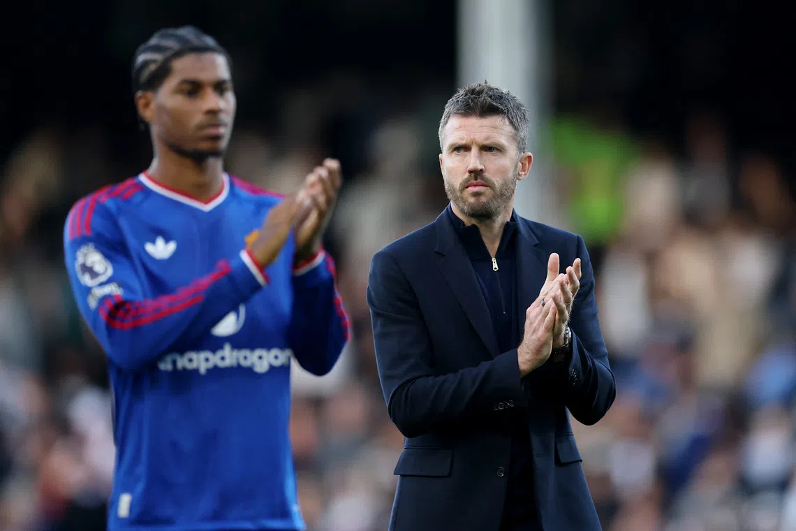Manchester United manager Michael Carrick applauds fans after his side avoided another defeat with a 1-1 draw at Fulham.