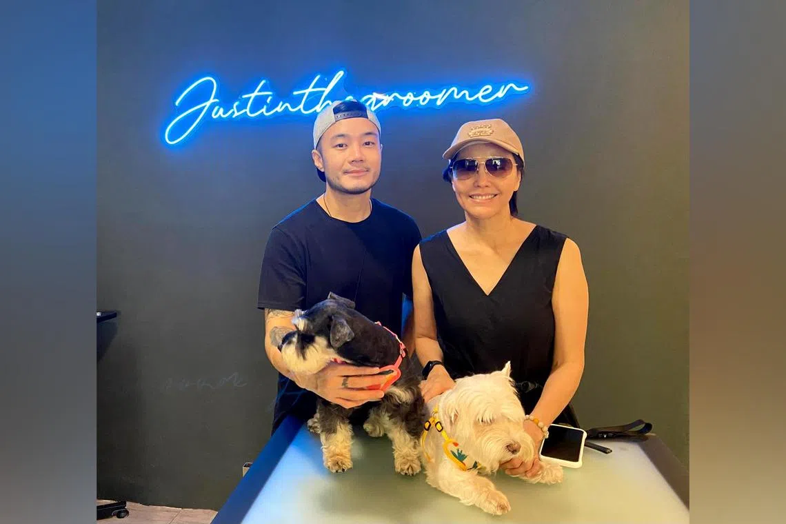 Mr Justin Tan, who runs pet grooming shop Justin The Groomer, with one of his celebrity clients, actress Zoe Tay.