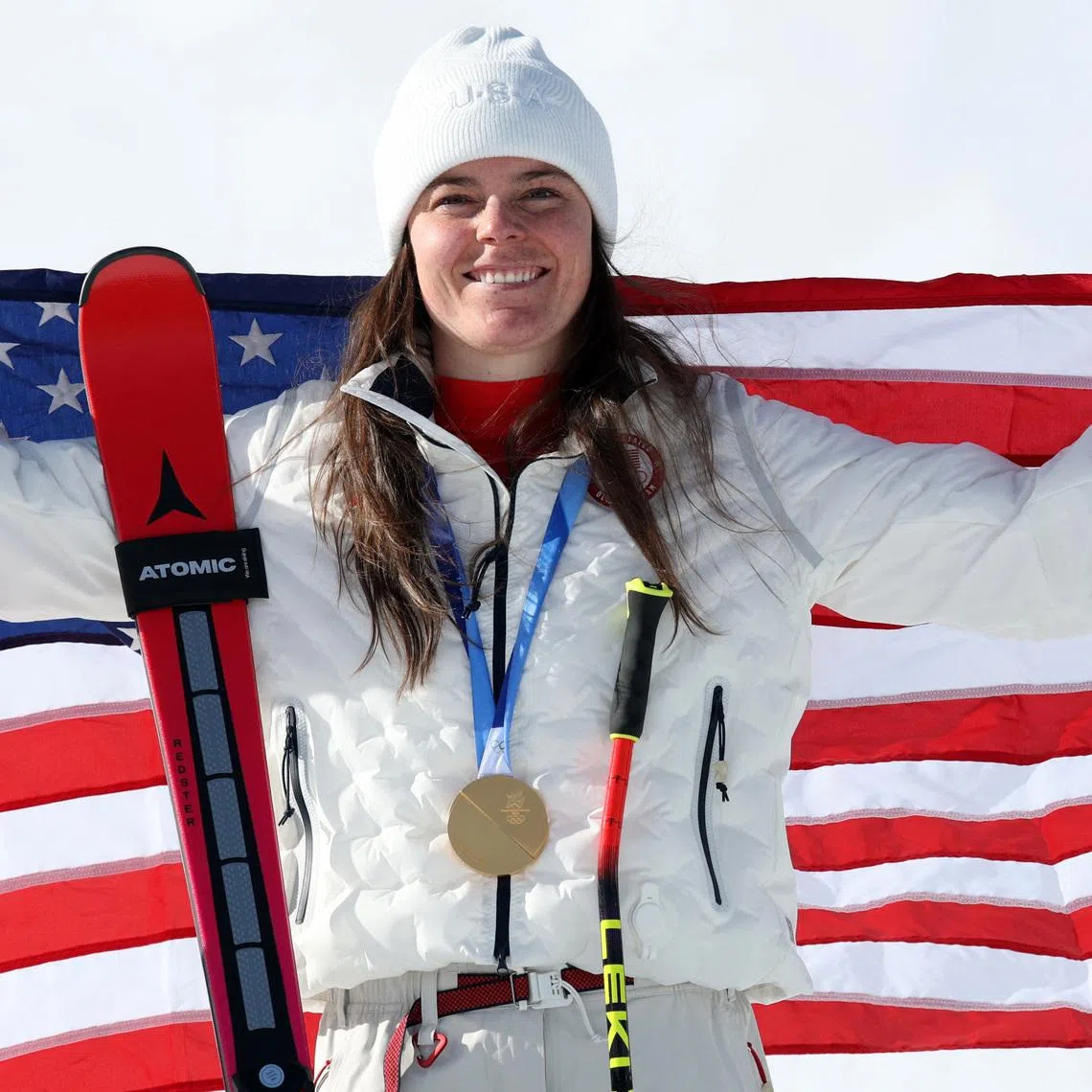 Milano Cortina 2026 Olympics - Alpine Skiing - Women's Downhill Victory Ceremony - Tofane Alpine Skiing Centre, Belluno, Italy - February 08, 2026. Gold medallist Breezy Johnson of United States celebrates after winning the women's downhill REUTERS/Leonhard Foeger
