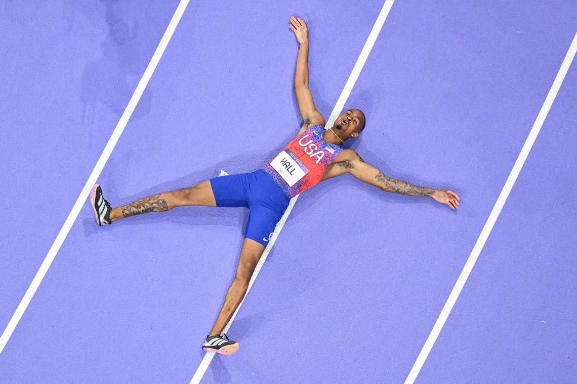 An overview shows Quincy Hall of the United States celebrating after winning the men's 400m final at the Paris Olympics.