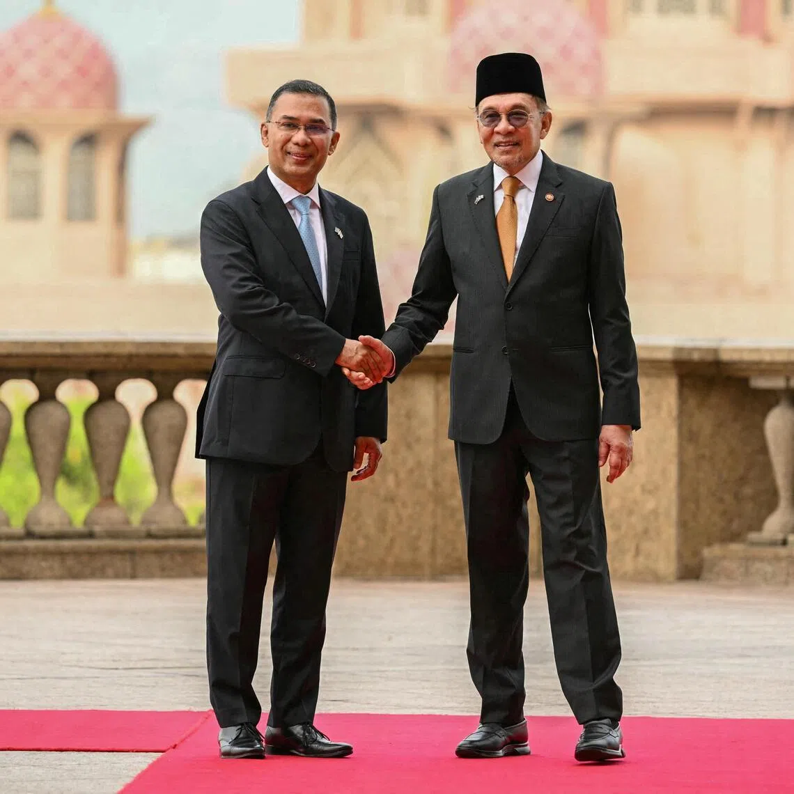 Malaysia's Prime Minister Anwar Ibrahim (right) shakes hands with Bangladesh's Prime Minister Tarique Rahman at the Federal Government office in Malaysia on June 22.