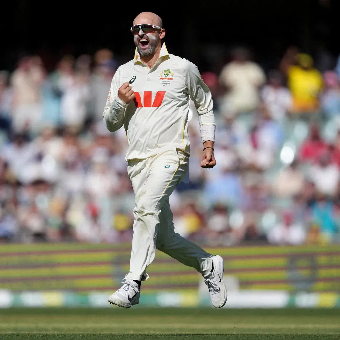 Cricket - The Ashes - Australia v England - Third Test - Adelaide Oval, Adelaide, Australia - December 20, 2025 Australia's Nathan Lyon celebrates after taking the wicket of England's Zak Crawley REUTERS/Asanka Brendon Ratnayake