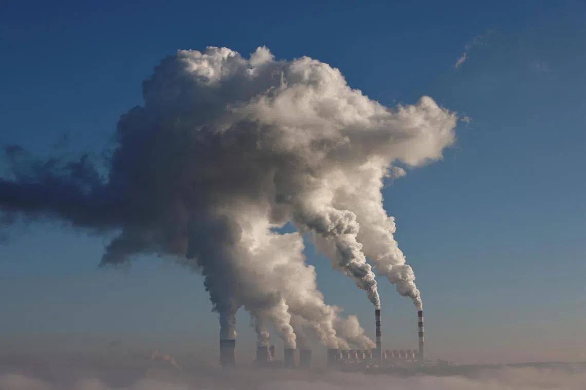 FILE PHOTO: Smoke and steam billow from Belchatow Power Station, Europe's largest coal-fired power plant powered by lignite, in Zlobnica, Poland October 20, 2022. REUTERS/Kuba Stezycki/File Photo