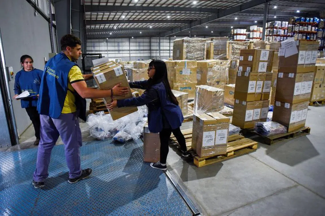 FILE PHOTO: Workers load ballot boxes and voting material into a truck, ahead of the presidential election, in Buenos Aires, Argentina October 21, 2023. REUTERS/Mariana Nedelcu/File Photo