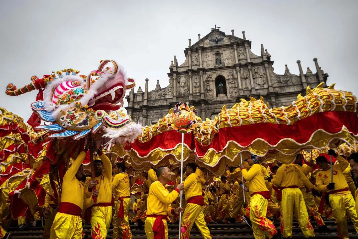 A Golden Dragon dances during a rehearsal at the St. Paul's Ruins during celebrations in Macau on February 10, 2024, on the first day of the Lunar New Year of the Dragon. (Photo by Eduardo Leal / AFP)
