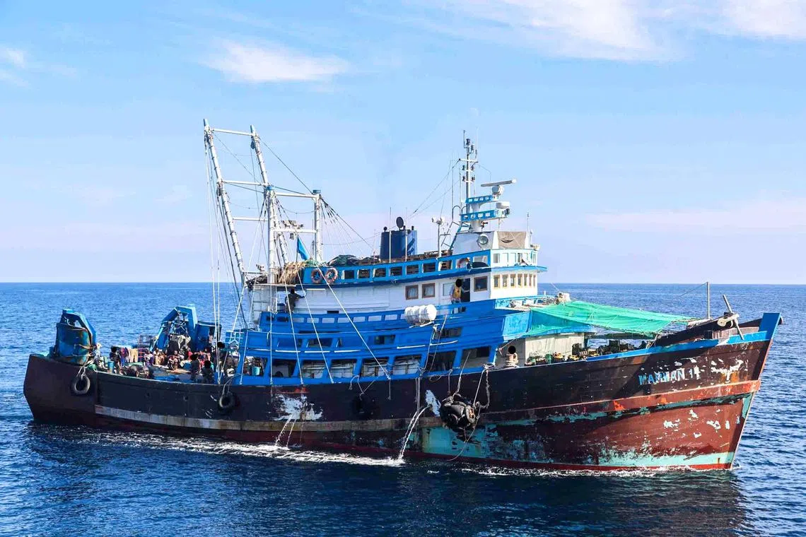 A million rounds of ammunition along with rocket fuses and propellant was being smuggled on a fishing trawler (above).