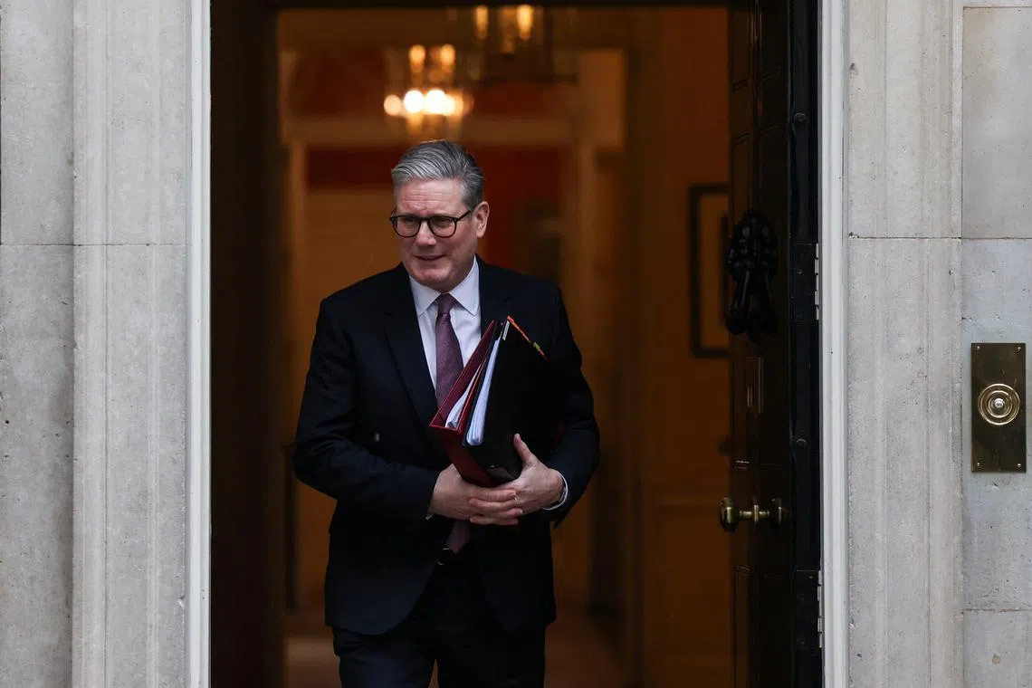 FILE PHOTO: British Prime Minister Keir Starmer walks in front of 10 Downing Street in London, Britain, February 26, 2025. REUTERS/Temilade Adelaja/File Photo