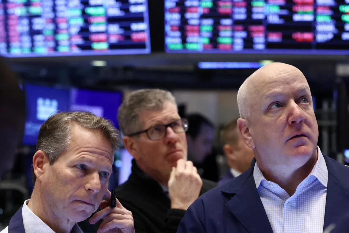 Traders work on the floor of the New York Stock Exchange.