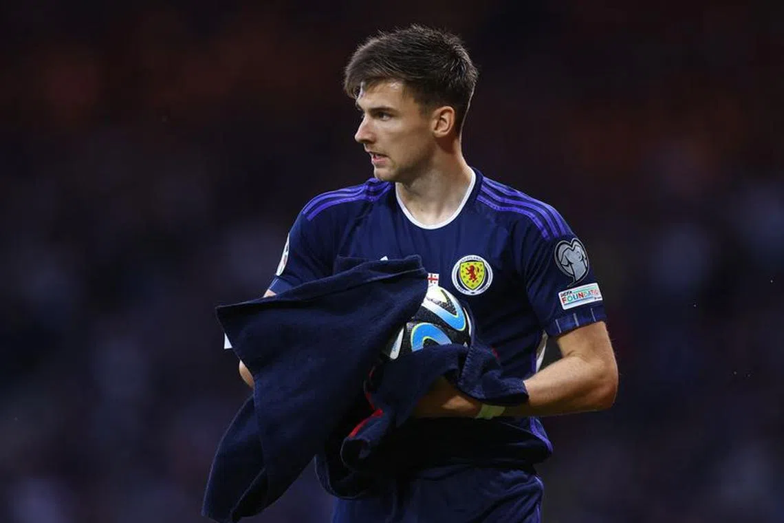 FILE PHOTO: Soccer Football - UEFA European Qualifiers - Group A - Scotland v Georgia  - Hampden Park, Glasgow, Scotland, Britain - June 20, 2023 Scotland's Kieran Tierney dries the ball with a towel during the match Action Images via REUTERS/Lee Smith/File Photo