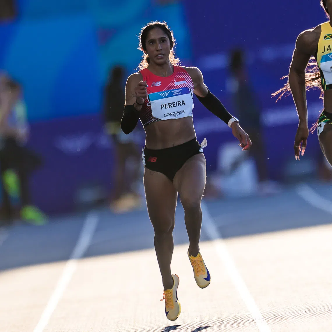Veronica Shanti Pereira on her way to finishing third behind Jamaica’s Ashanti Moore and winner Adaejah Hodge from the British Virgin Islands (right) in the second semi-final of the Commonwealth Games women’s 200m event on July 30.