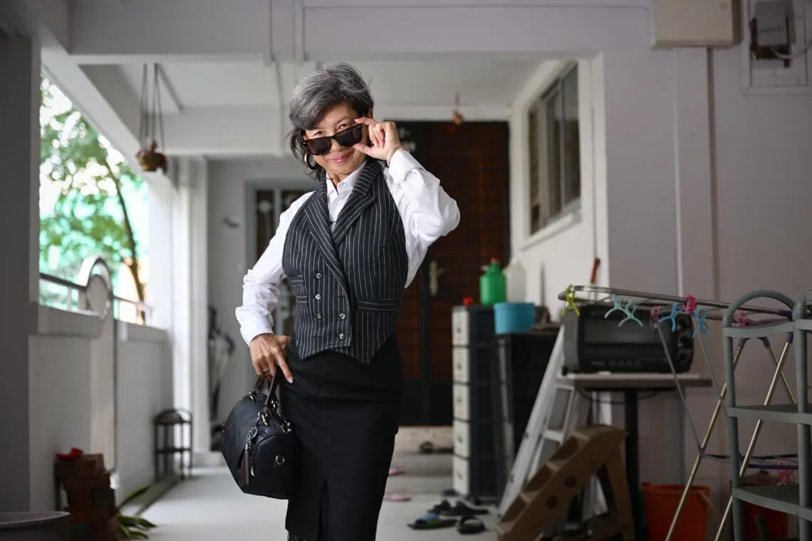 Known on TikTok as “corridor runway auntie”, Vicsland Poh’s HDB corridor is her fashion runway.