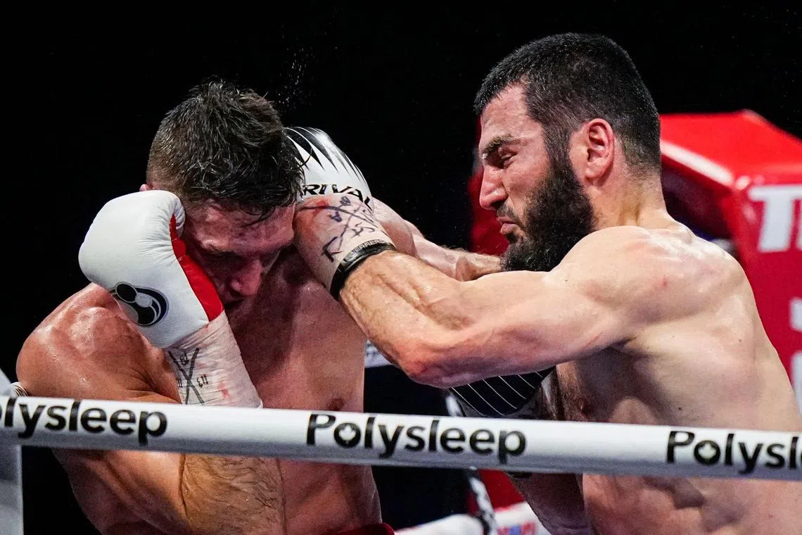 Artur Beterbiev of Canada punching Englishman Callum Smith during their WBC, IBF and WBO light heavyweight world championship fight at Videotron Centre on Jan 13 in Quebec City, Canada. Beterbiev won by knockout in the seventh round.