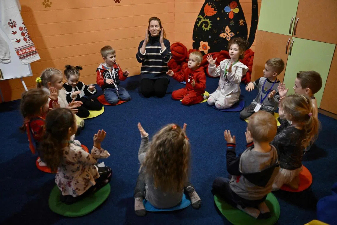 Children play in an air-raid shelter in the cellar of a kindergarten in Kyiv on March 20.