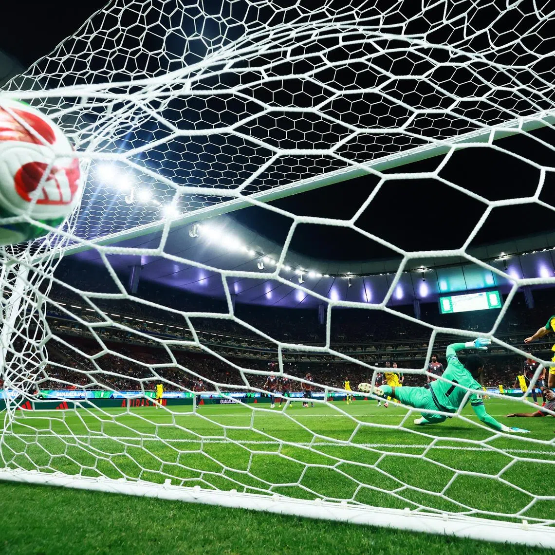 Soccer Football - FIFA World Cup - Inter-Confederation Playoffs - Semi Final - New Caledonia v Jamaica - Estadio Guadalajara, Guadalajara, Mexico - March 26, 2026 Jamaica's Bailey-Tye Cadamarteri scores their first goal REUTERS/Eloisa Sanchez