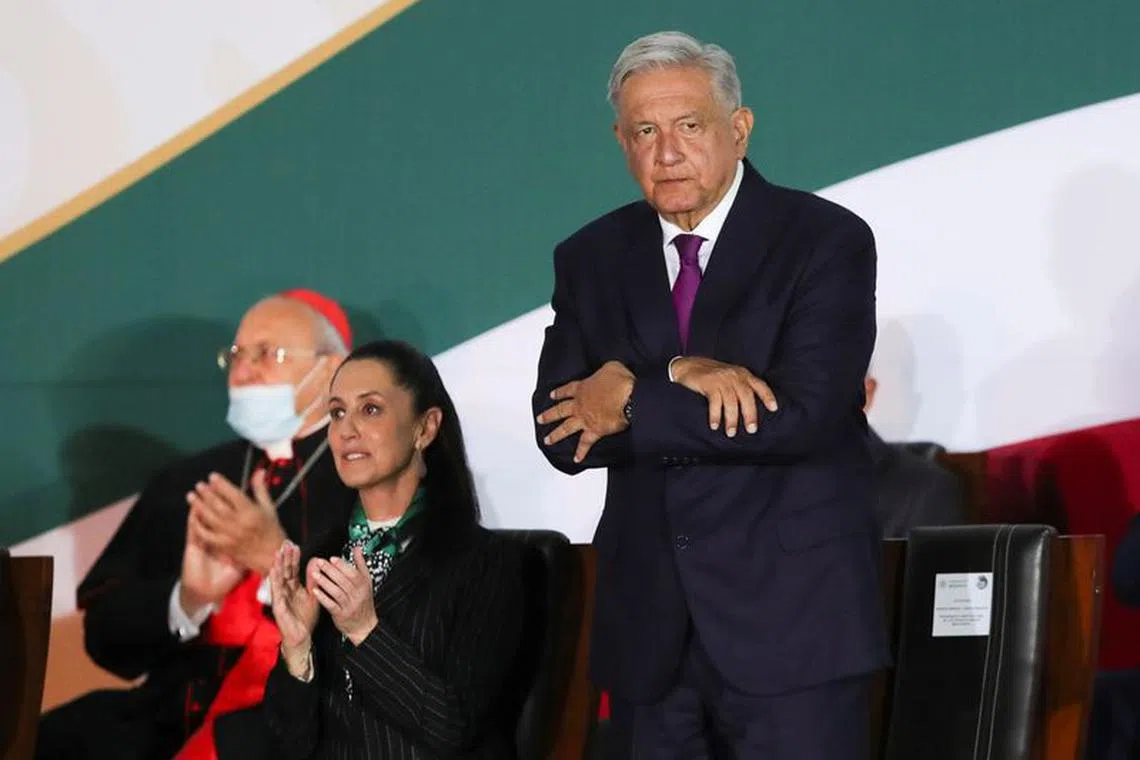 Mexico's President Andres Manuel Lopez Obrador and Mexico City Mayor Claudia Sheinbaum attend an event to commemorate the 200th Anniversary of the Consummation of the Independence of Mexico outside the National Palace, in Mexico City, Mexico, September 27, 2021.  REUTERS/Henry Romero/File photo
