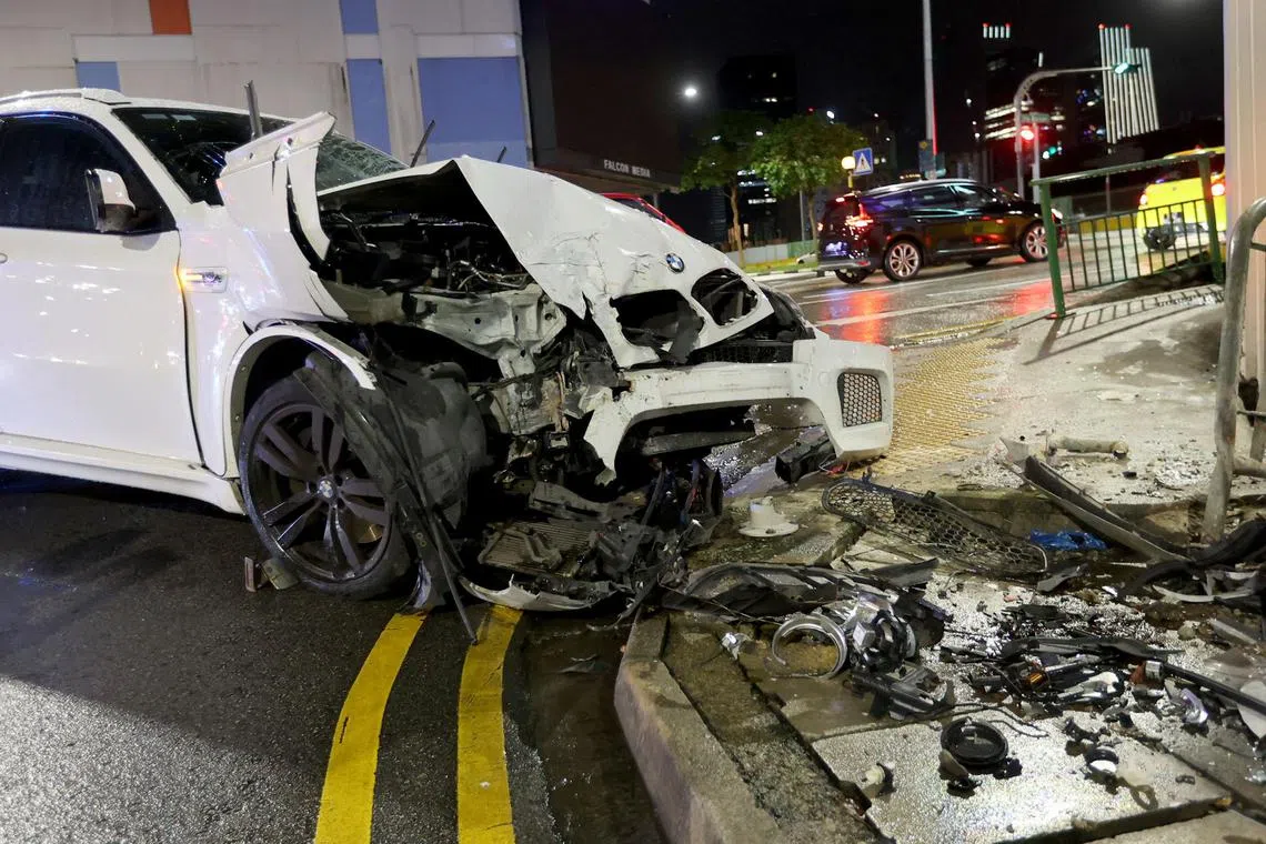 Four people were taken to hospital after a car hit a man and then rammed into a building on Thursday night. 