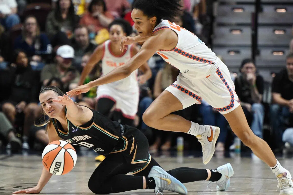 The Connecticut Sun's Leila Lacan and the New York Liberty's Sabrina Ionescu in action during the second half at Mohegan Sun Arena on Aug 3.