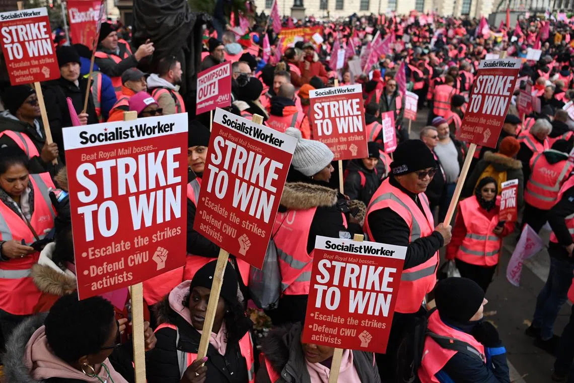 Royal Mail workers rally outside Parliament in London, on Dec 9, 2022.