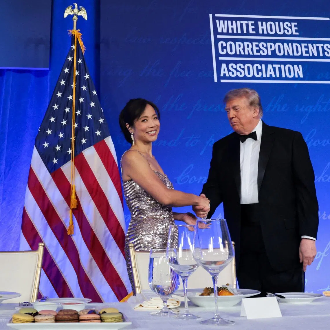 US President Donald Trump (right) shake hands with CBS News senior White House correspondent Weijia Jiang at the White House Correspondents’ Association Dinner on July 24.