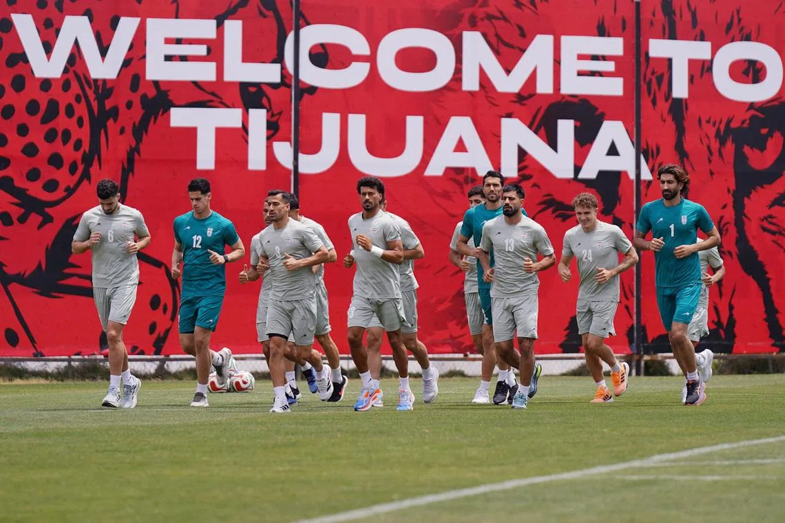 Iran's Saeid Ezatolahi, Payam Niazmand, Ehsan Hajsafi, Ramin Rezaeian, Hossein Kanani, Dennis Dargahi and Alireza Beiranvand during training on June 11.
