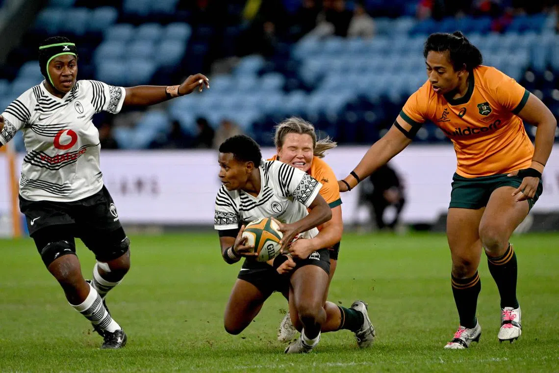 Wallaroos’ Bree-Anna Cheatham tackles Fijiana's Evivi Senikarivi during the Women's Rugby match between the Australia and Fiji at the Allianz Stadium in Sydney on May 20, 2023.