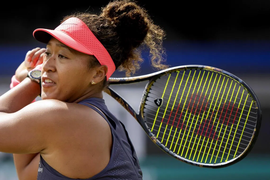 epa11406034 Naomi Osaka of Japan in action during her match against Suzan Lamens of Netherlands at the 's-Hertogenbosch tennis tournament in Rosmalen, Netherlands, 12 June 2024.  EPA-EFE/Sander Koning