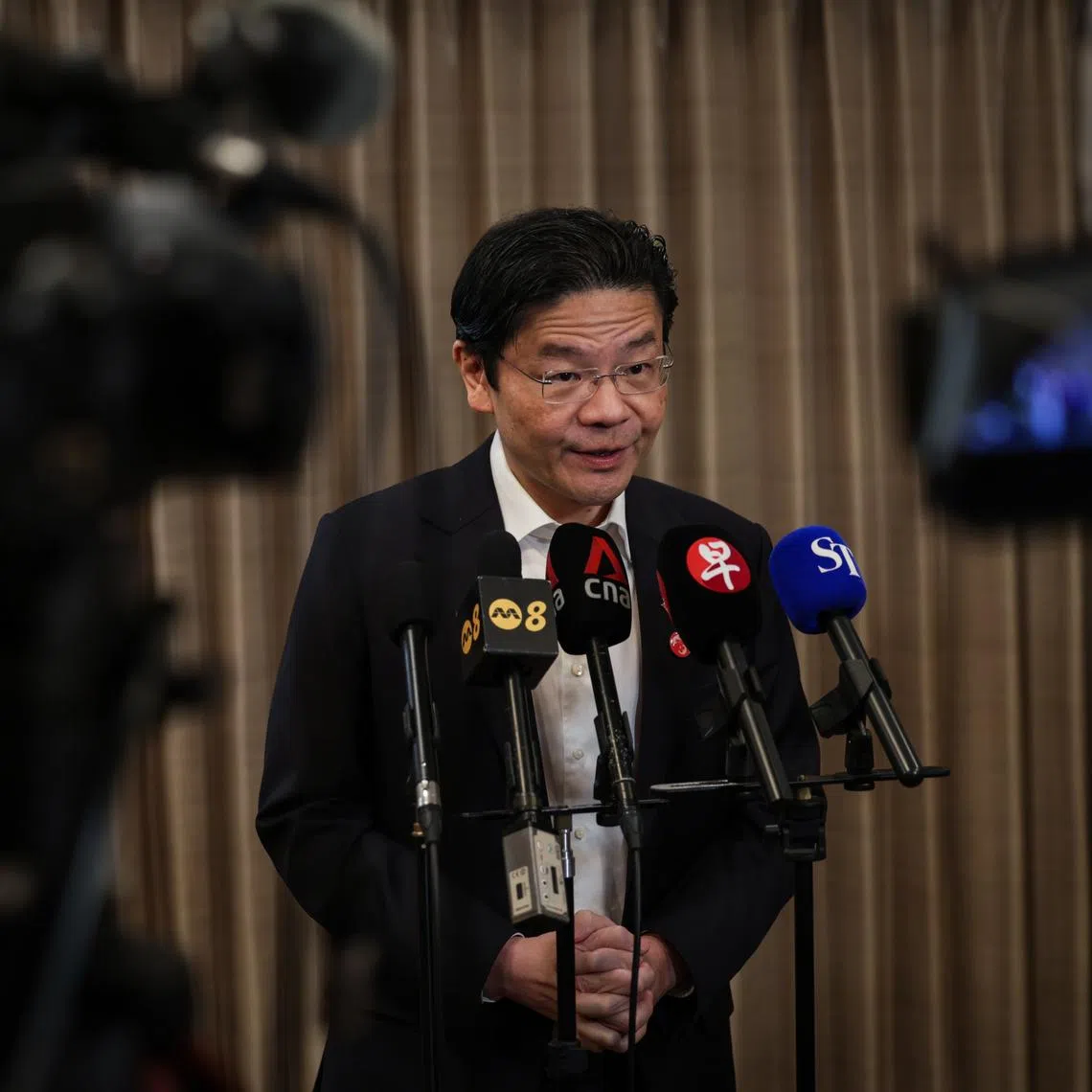 Prime Minister Lawrence Wong speaking to media during his official visit to Japan, on March 18.