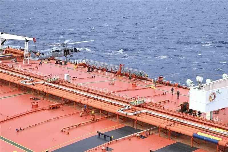The US Department of Defence posted video footage showing helicopters landing on a large, bright orange tanker.