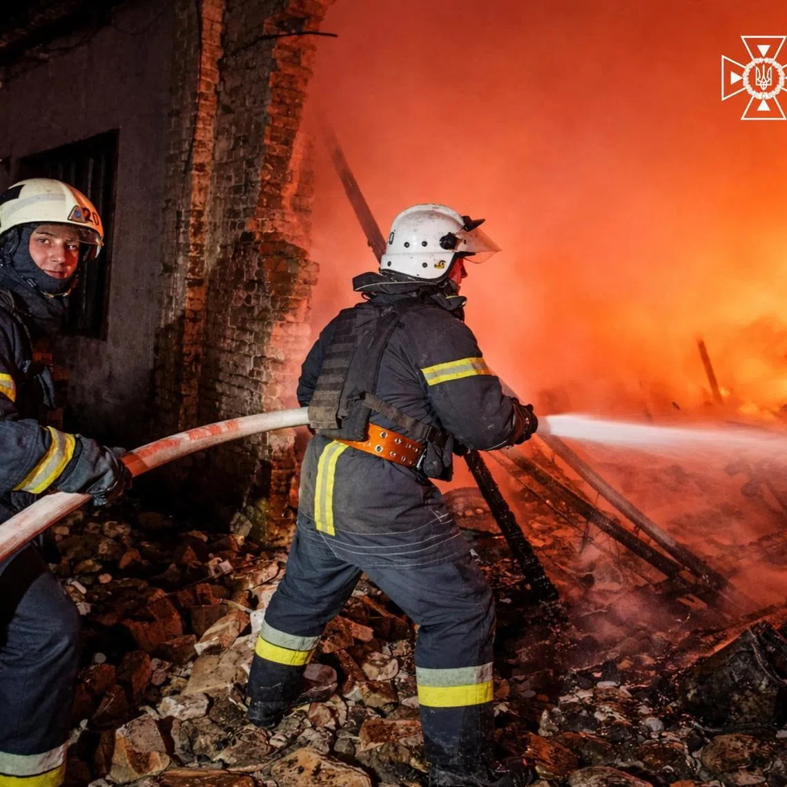 Firefighters work at the site of a vehicles repair workshop hit during overnight Russian drone strikes, amid Russia's attack on Ukraine, in Odesa region, Ukraine April 14, 2026. Press service of the State Emergency Service of Ukraine in Odesa region/Handout via REUTERS ATTENTION EDITORS - THIS IMAGE HAS BEEN SUPPLIED BY A THIRD PARTY. DO NOT OBSCURE LOGO.