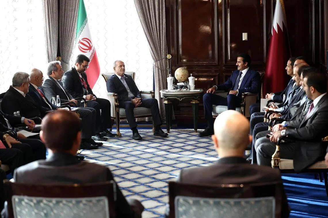 Iranian President Masoud Pezeshkian meeting Qatari Emir Sheikh Tamim bin Hamad Al Thani in Moscow, Russia, on Oct 27.