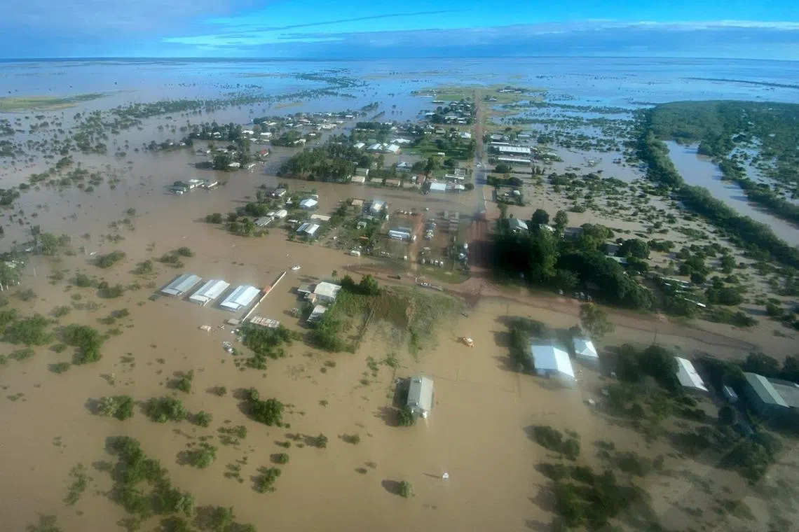 This handout photo taken on March 10, 2023 and received on March 11, 2023 from the Queensland Police Service shows an aerial view of the flooded northern Queensland town of Burketown. - Police urged all residents of the remote Australian town to evacuate on March 11, 2023, warning that record-high floodwaters were expected to rise further over the weekend. (Photo by Handout / QUEENSLAND POLICE SERVICE / AFP) / ----EDITORS NOTE ----RESTRICTED TO EDITORIAL USE MANDATORY CREDIT " AFP PHOTO / QUEENSLAND POLICE SERVICE" NO MARKETING NO ADVERTISING CAMPAIGNS - DISTRIBUTED AS A SERVICE TO CLIENTS
