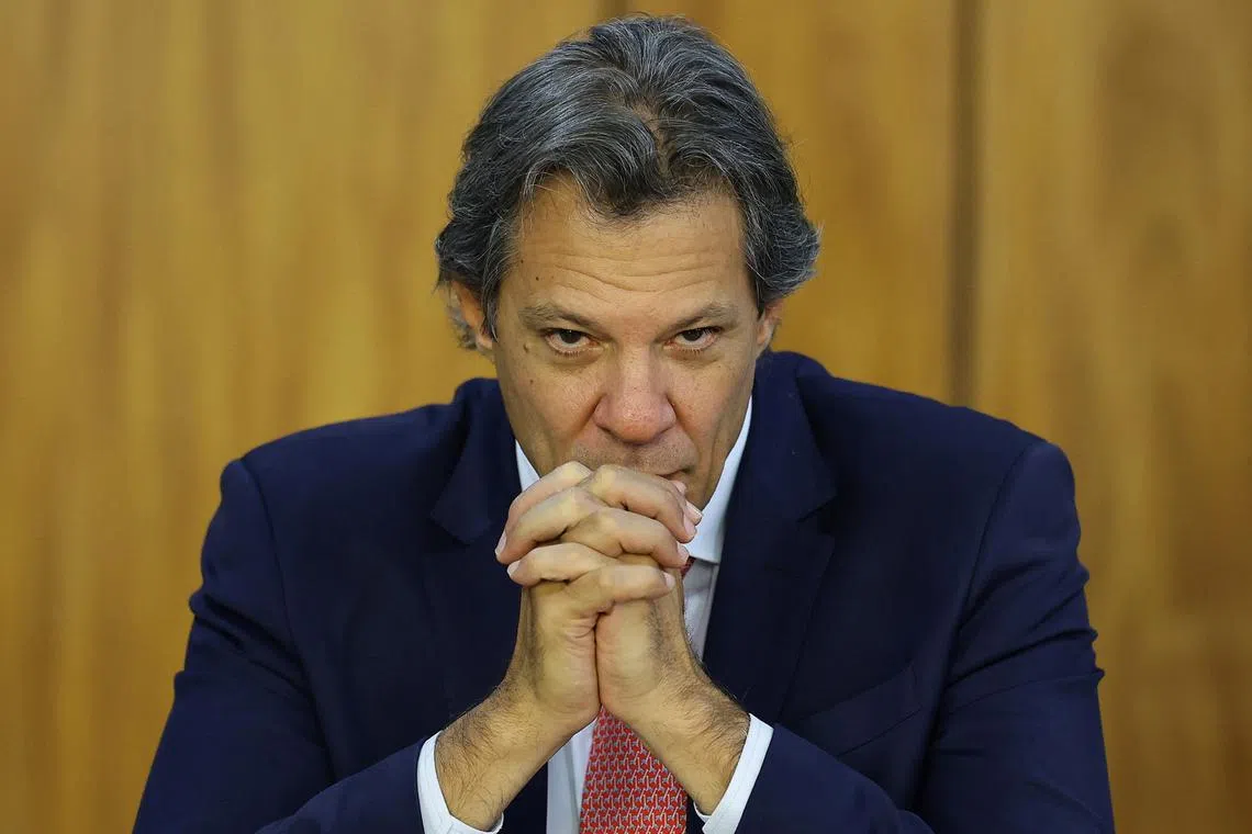FILE PHOTO: Brazil's Finance Minister Fernando Haddad gestures during a meeting with Brazil's President Luiz Inacio Lula da Silva to announce new ApexBrasil projects, at the Planalto Palace in Brasilia, Brazil, September 17, 2024. REUTERS/Ueslei Marcelino/File Photo