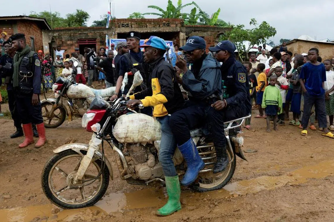 FILE PHOTO: Congolese police officers secure the streets during a campaign rally of presidential candidate Moise Katumbi in Kitutu village within Mwenga territory of South Kivu province, Democratic Republic of the Congo November 24, 2023. REUTERS/Arlette Bashizi/File Photo