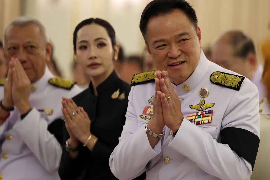 Thailand's Prime Minister Anutin Charnvirakul greets his cabinet on the day he speaks to members of the media to announce the dissolution of parliament at the Government House in Bangkok, Thailand, December 12, 2025. REUTERS/Chalinee Thirasupa