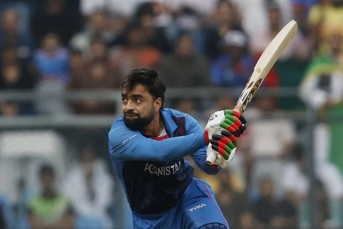 FILE PHOTO: Cricket - ICC Cricket World Cup 2023 - Australia v Afghanistan - Wankhede Stadium, Mumbai, India - November 7, 2023 Afghanistan's Rashid Khan in action REUTERS/Francis Mascarenhas/File Photo
