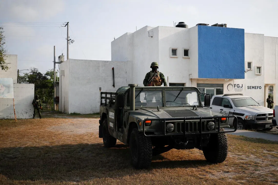 Mexican soldiers guarding the Forensic Medical Service morgue ahead of the transfer of the bodies of two Americans who were kidnapped to the US border, in Matamoros, Mexico, on March 9, 2023. 