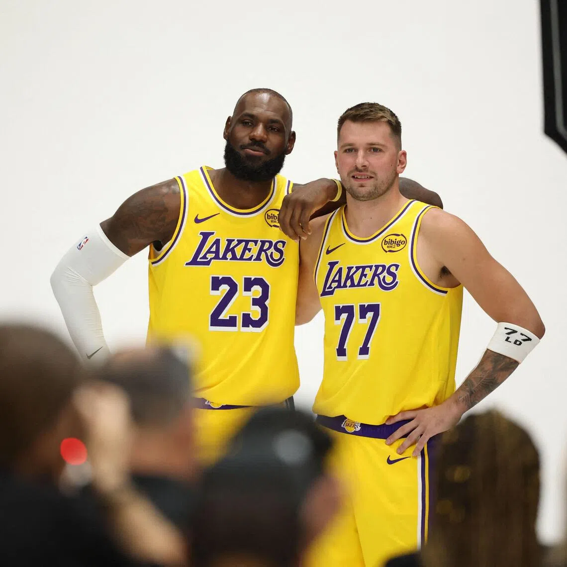 LeBron James and Luka Doncic pose for photos during the Los Angeles Lakers' media day.