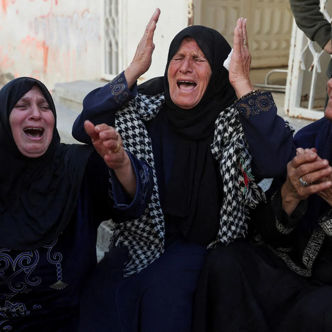 Mourners react during the funeral of Palestinians killed in an Israeli strike, according to medics, in Gaza City, March 28, 2026. REUTERS/Dawoud Abu Alkas