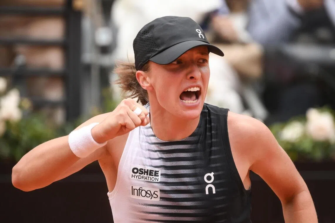 Poland's Iga Swiatek celebrates winning her quarter-final match against Jessica Pegula on May 13. It was a show of force on her preferred surface not seen since she last won the French Open two years ago.