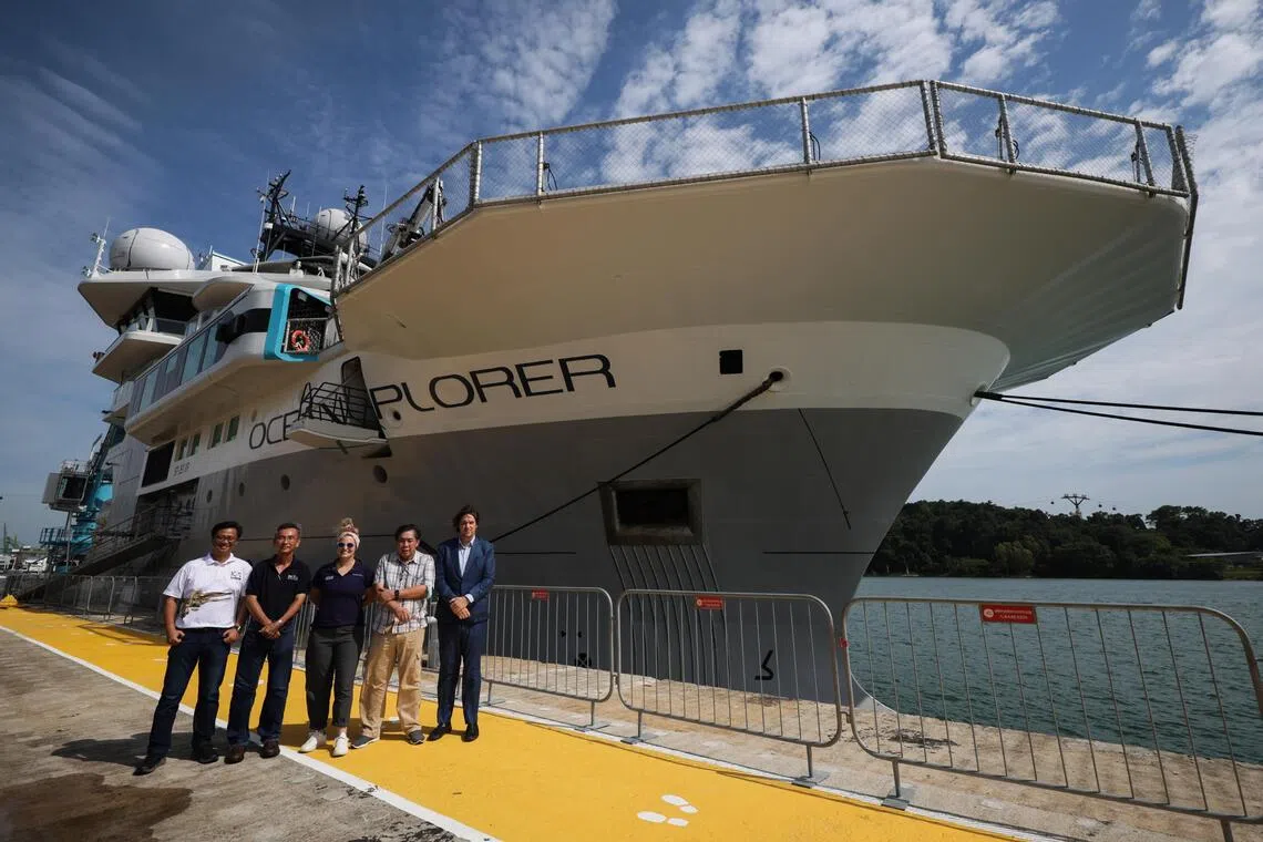 OceanX-NUS research team members Lee Kong Chian Natural History Museum senior research fellow Dr Jose Mendoza, Tropical Marine Science Institute marine biology and ecology laboratory head Dr Tan Koh Siang, OceanX science programme director Mattie Rodrigue, Lee Kong Chian Natural History Museum advisor Prof Peter Ng and OceanX founder and co-CEO Mark Dalio, together with the OceanXplorer scientific vessel at Marina at Keppel Bay on Oct 29, 2025.