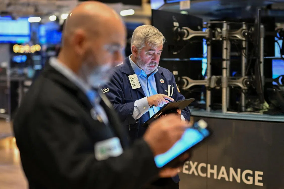 Traders work on the floor of the New York Stock Exchange, in New York City. 