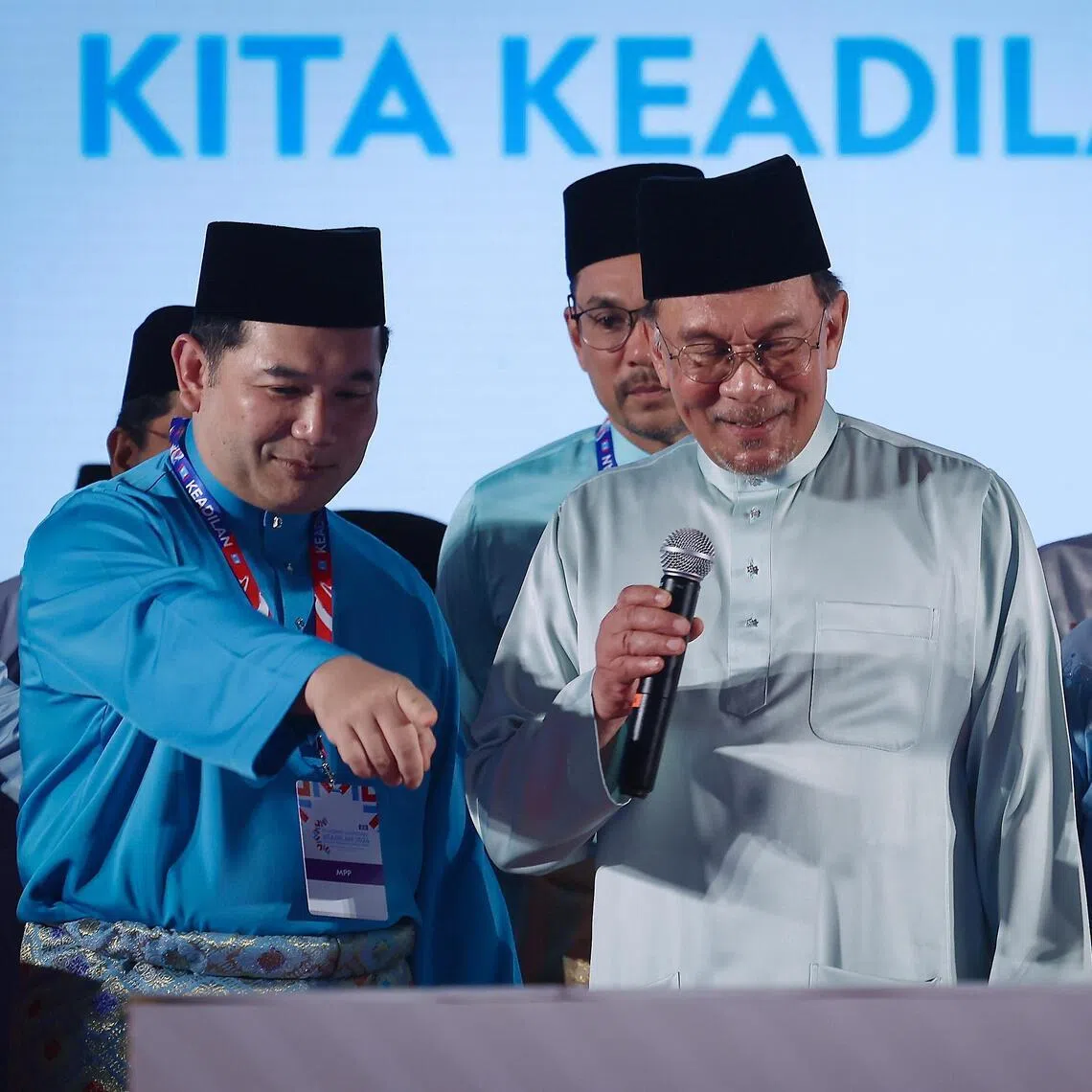 Malaysia's former economy minister Rafizi Ramli (left) and nine other MPs aligned to him broke ranks with colleagues in PM Anwar Ibrahim's government over an attempt create a new office of Public Prosecutor on March 2.